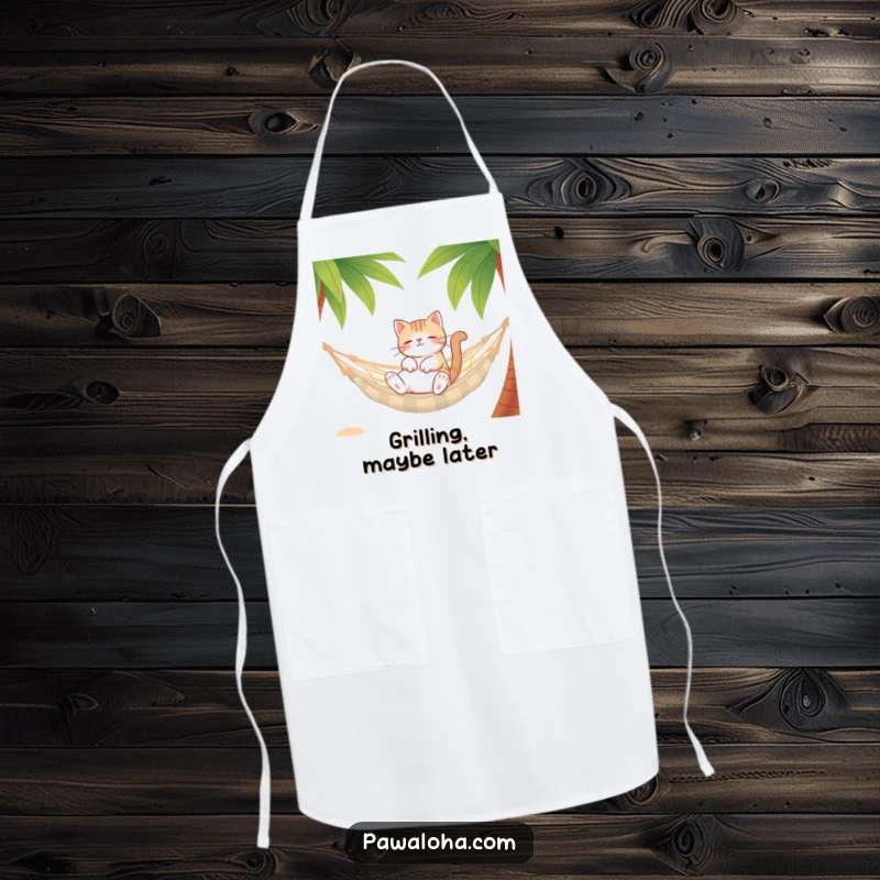 Funny Cat Hammock Apron showing a relaxed cat character in a hammock between palm trees. Humorous kitchen accessory.
