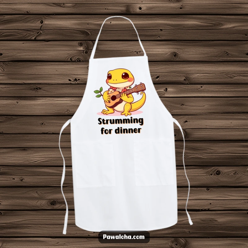 Funny apron depicting a kawaii gecko wearing a lei and playing a tiny ukulele, adding a musical and tropical touch to cooking.