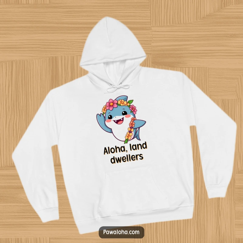 Funny shark hoodie depicting a friendly shark wearing a lei and giving a cheerful wave, ideal for cozy ocean-themed relaxation.