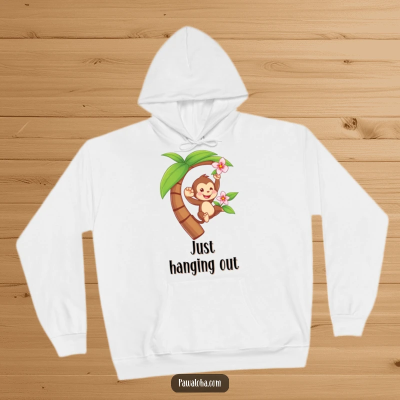 Funny hoodie with a playful monkey swinging from a palm tree, holding a flower, offering cozy jungle vibes.