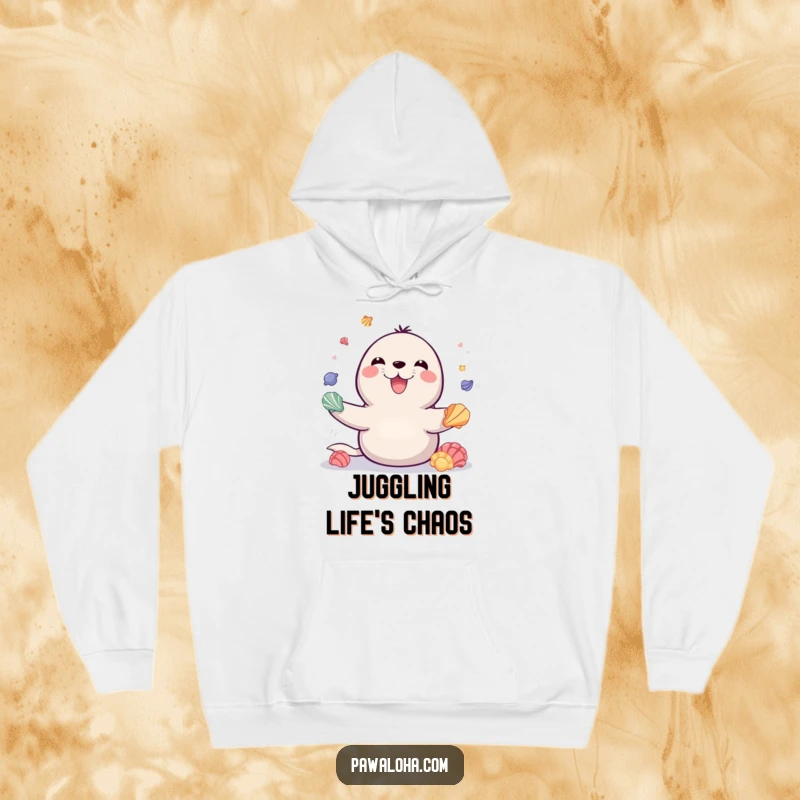 Funny hoodie featuring a playful seal with a huge smile, juggling colorful seashells, offering cozy comfort and delightful marine humor.