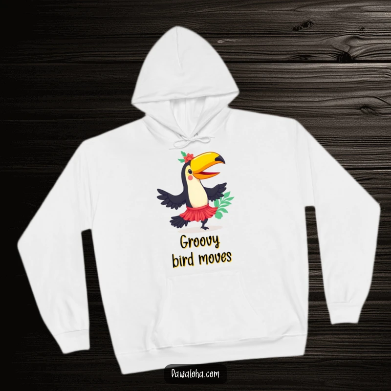 Funny toucan character in a hula skirt, dancing with tropical flair on a cozy hoodie, bringing warmth and smiles.