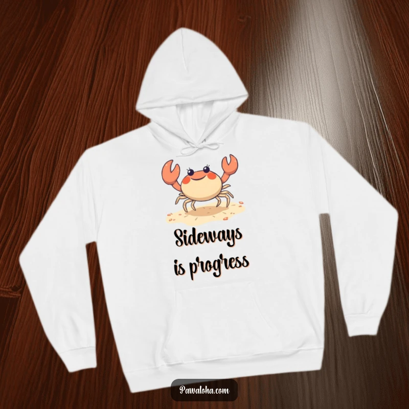 Funny crab hoodie with a cute character joyfully doing a sideways shuffle on the sand, perfect for cozy beach vibes.