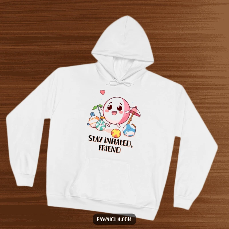 Funny beach ball hoodie showcasing a playful character bouncing with beach toys, offering warmth and a touch of summer fun.