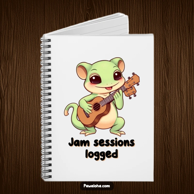 Funny Kawaii gecko strumming a ukulele on a notebook, perfect for writing lyrics and notes.
