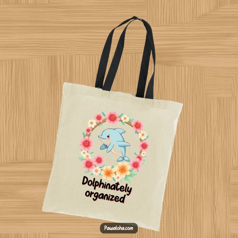 Funny Kawaii dolphin joyfully leaping through a flower hoop, featured on a durable and stylish tote bag.