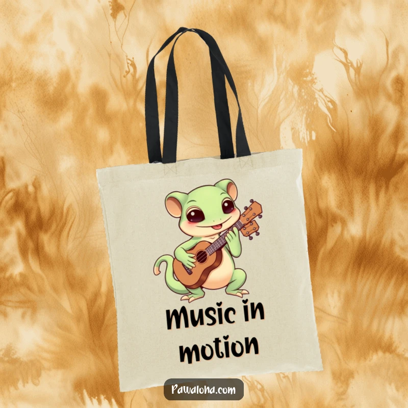 Funny Kawaii gecko enthusiastically playing the ukulele on a tote bag, great for carrying music gear.